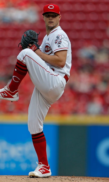 Puig homers again; Reds lose Scooter but beat Brewers 3-0